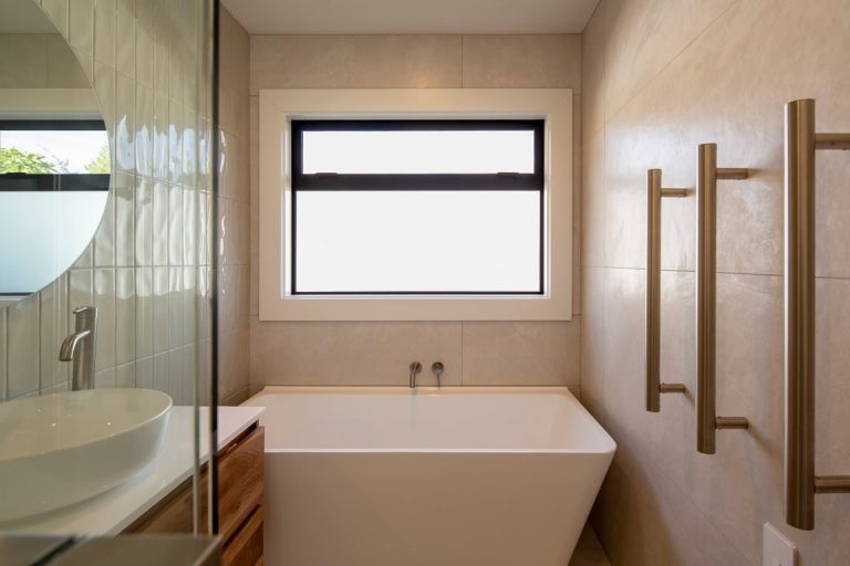 Bathroom with freestanding bath and shower at Arrowtown Gem
